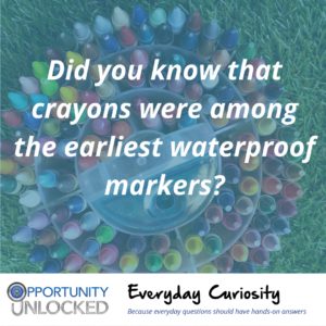 White text overlaid on a picture of a circular container full of crayons reads "Did you know that crayons were among the earliest waterproof markers?" The banner at the bottom includes the full Opportunity Unlocked logo and "Everyday Curiosity: Because everyday questions should have hands-on answers"