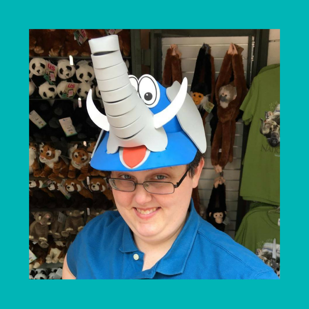 Lindsey at the zoo sporting an elephant hat with far too much personality