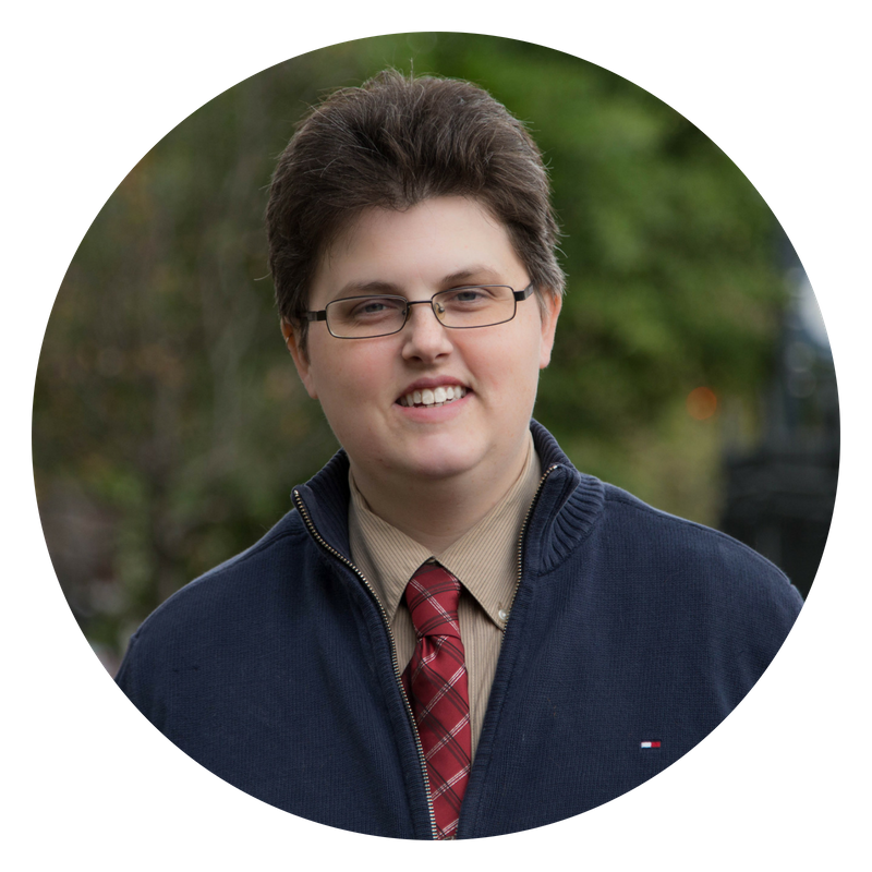 A close-up headshot of Lindsey Nelson, founder of Opportunity Unlocked. Lindsey is smiling outside.